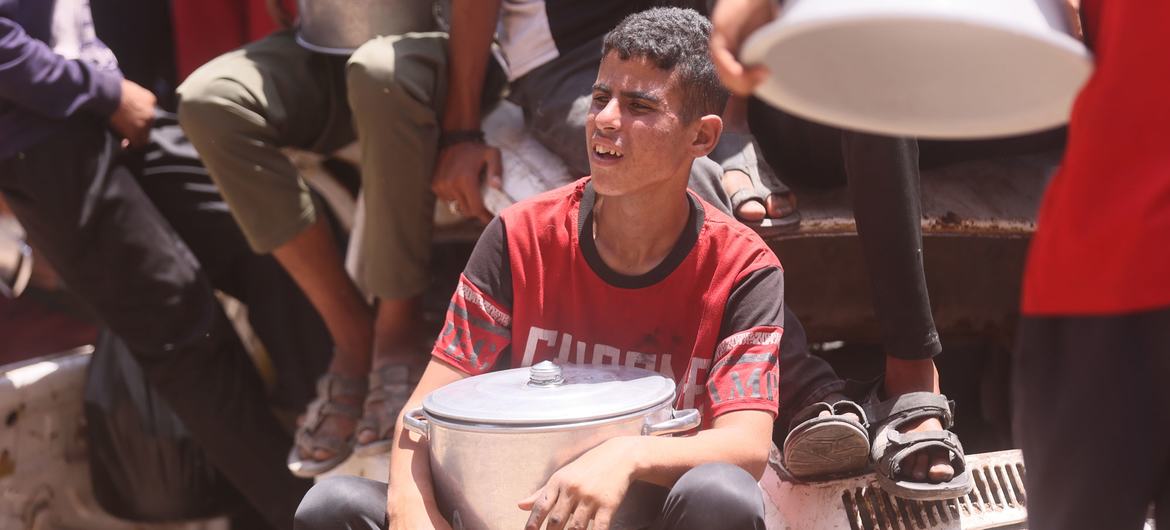 A boy in Gaza waits for food. A boy in Gaza waits for food.
