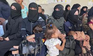 Mothers and their children in Syria waiting to be tested for malnutrition.