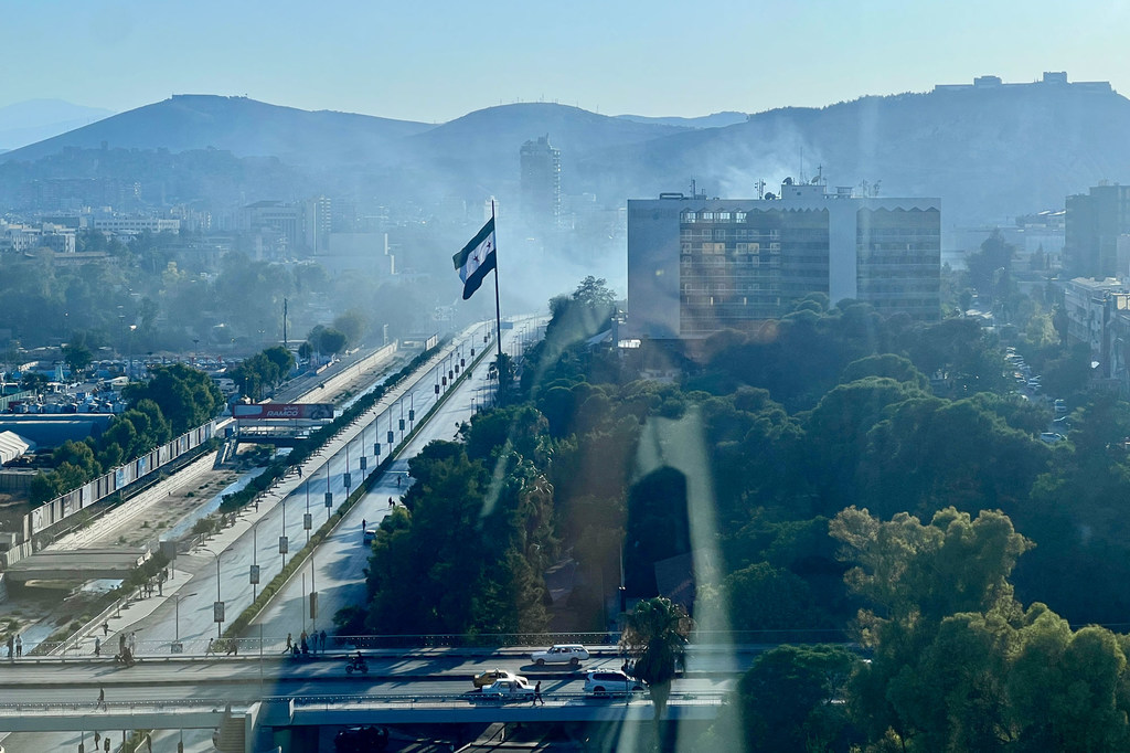 smoke from bombed Ministry of Defence building in Damascus (July 2025)