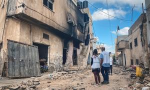 Aid workers assess the damage following a military raid on a refugee camp in Jenin. (file, July 2023)