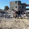 Palestinian refugees stand next to their demolished home in Jenin, West Bank. (file)