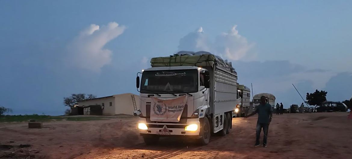 Trucks carrying vital food supplies cross from Chad into Sudan via the Adre border crossing.