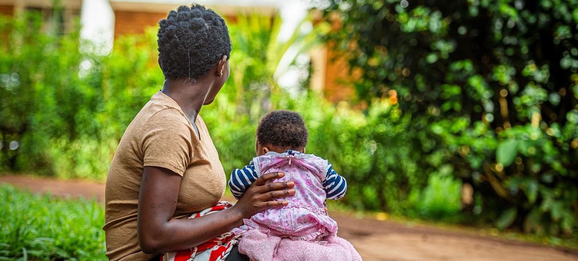 A 17-year-old rape survivor sits with her child in the eastern DR Congo.