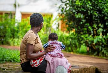 A 17-year-old rape survivor sits with her child in the eastern DR Congo.