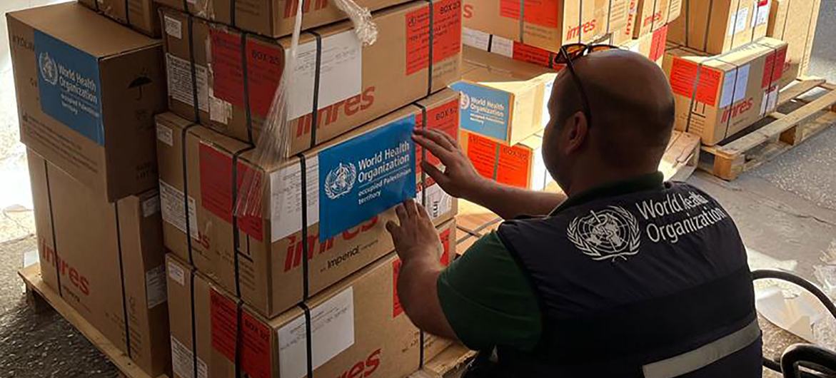 A WHO worker in Gaza prepares essential medical supplies for distribution. A WHO worker in Gaza prepares essential medical supplies for distribution.