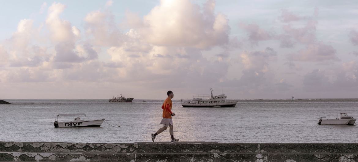 A man jogs along the harbour wall in Apia, the capital of Samoa.