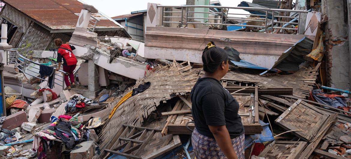 A woman in Mandalay, Myanmar, looks on at the devastation caused by the earthquake. A woman in Mandalay, Myanmar, looks on at the devastation caused by the earthquake.