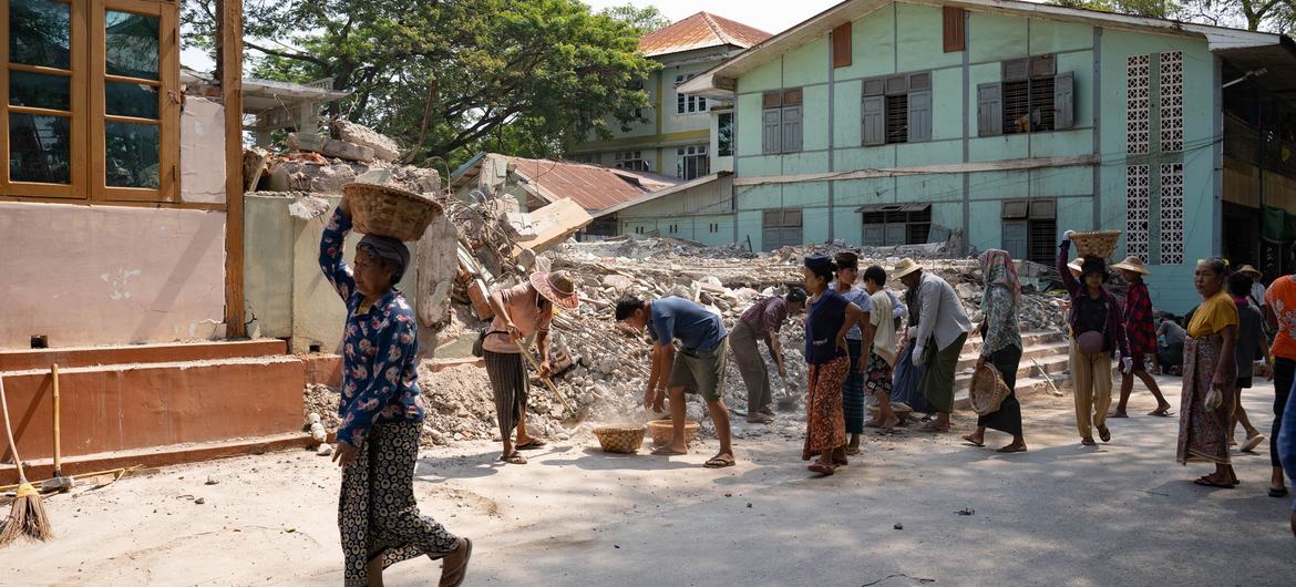 People in Mandalay, Myanmar, remove debris following the earthquake in March 2025.