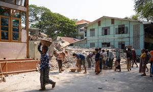 People in Mandalay, Myanmar, remove debris following the earthquake in March 2025.