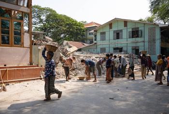 People in Mandalay, Myanmar, remove debris following the earthquake in March 2025.