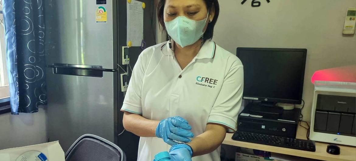 A health worker at the Ozone Foundation in Bangkok, Thailand prepares a hepatitis C test.