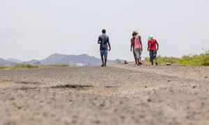 Weary from exhaustion, thirst and hunger, migrants make their way along the road to Lahij in Yemen.