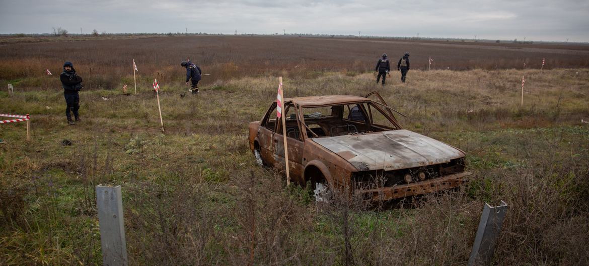 Deminers try to clear a previously occupied area near the front line between Mykolaiv and Kherson, in Ukraine.