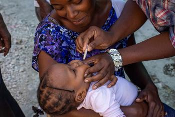 A young child is vaccinated against cholera in Haiti.