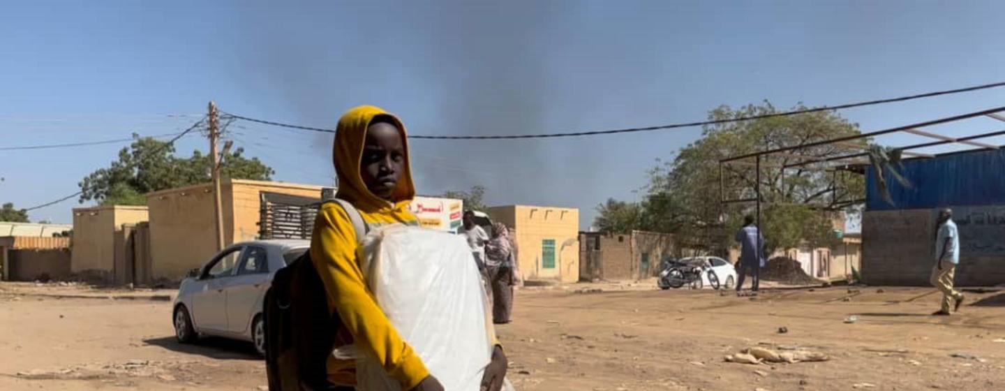A child flees from Wad Madani, Al Jazirah state  east-central Sudan following recent armed clashes there.