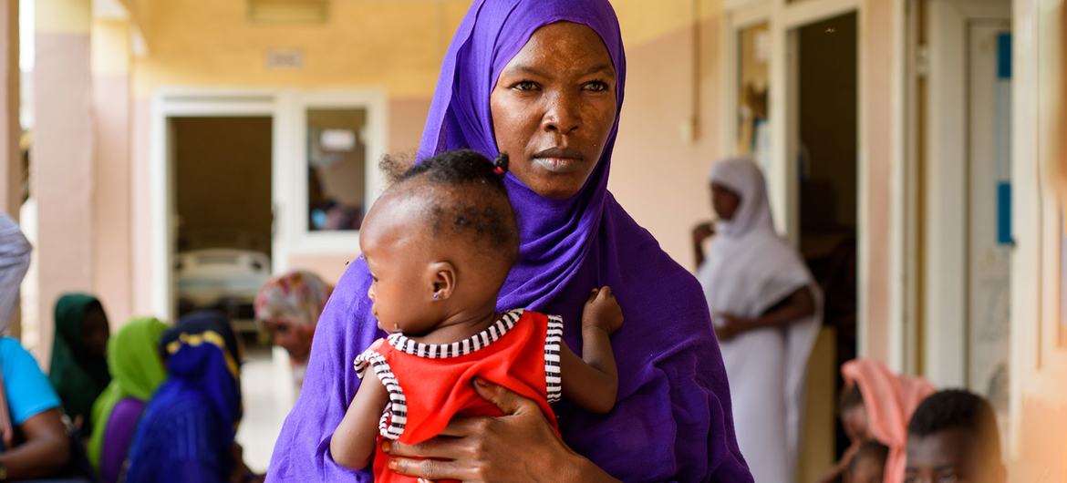 A child enrolled at a malnutrition clinic in Port Sudan, with her mother.