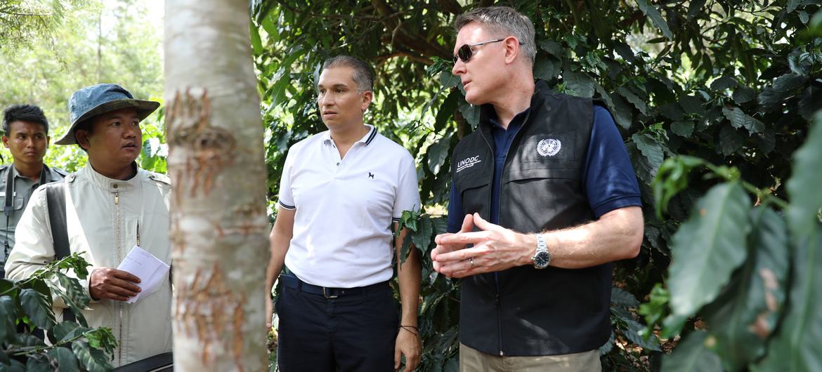 UNODC's Jeremy Douglas (right) meets Shan hill tribe community leaders in a remote part of the Golden Triangle. 