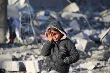 A girl stands amidst the rubble of her destroyed home in Rafah, Gaza.