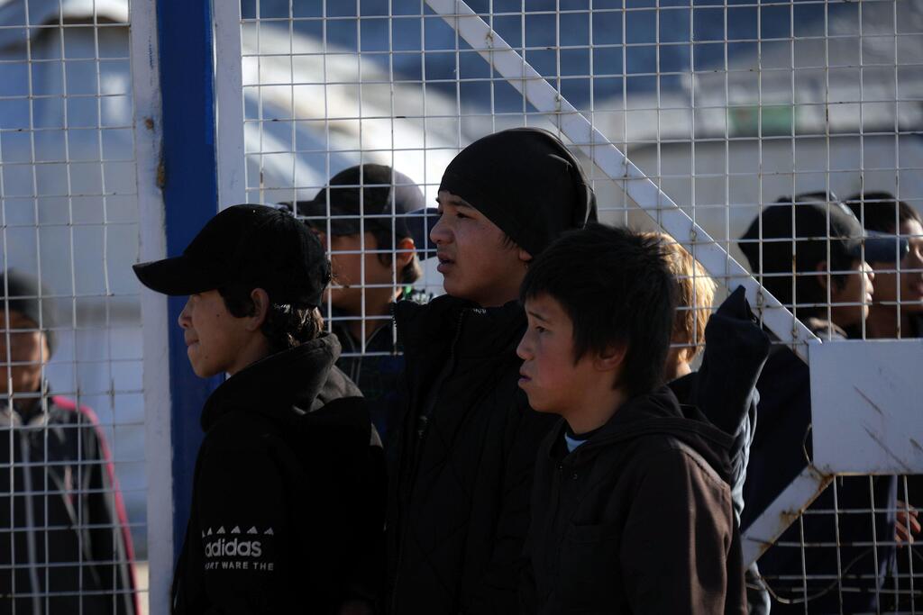 Дети в лагере для вынужденных переселенцев в Сирии.