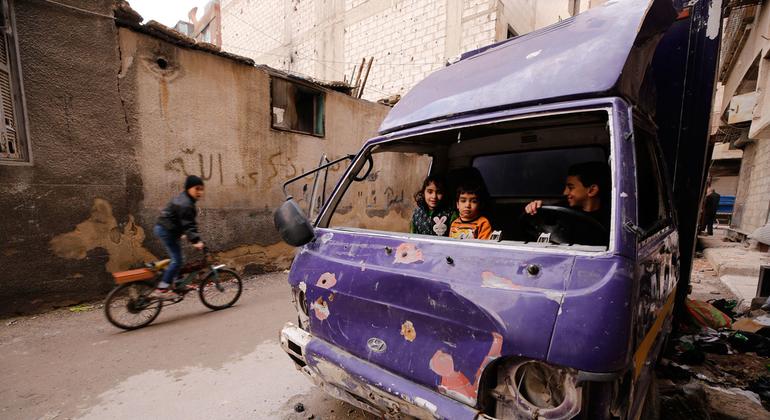 Children play in a damaged truck in Douma, Syria.