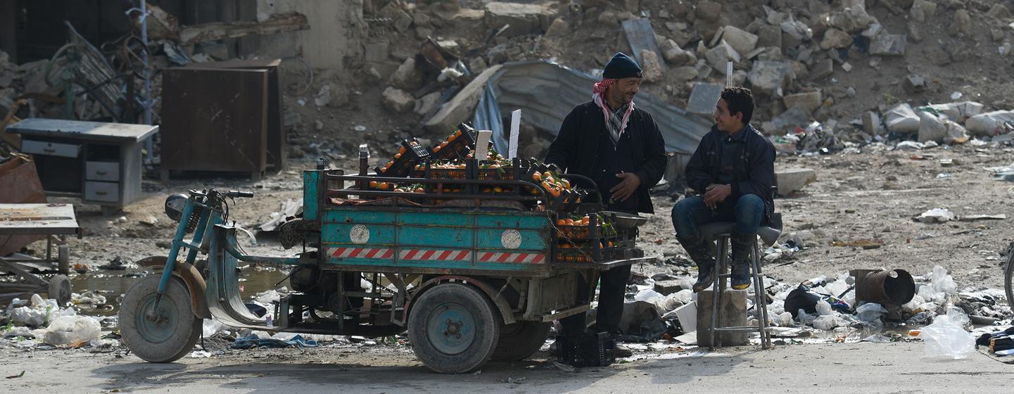 A man sells oranges in Douma in Syria after the siege of the city was lifted in 2018.