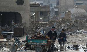 A man sells oranges in Douma in Syria after the siege of the city was lifted in 2018.