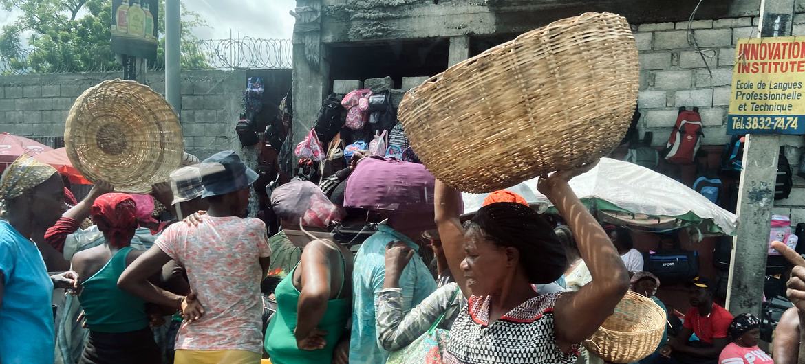 People shop at a market in the Haitian capital, Port-au-Prince.