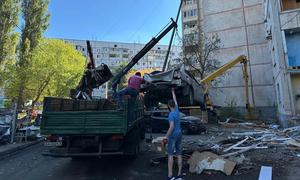 Debris is cleared following an attack on in Kharkiv City on 22 September 2024,