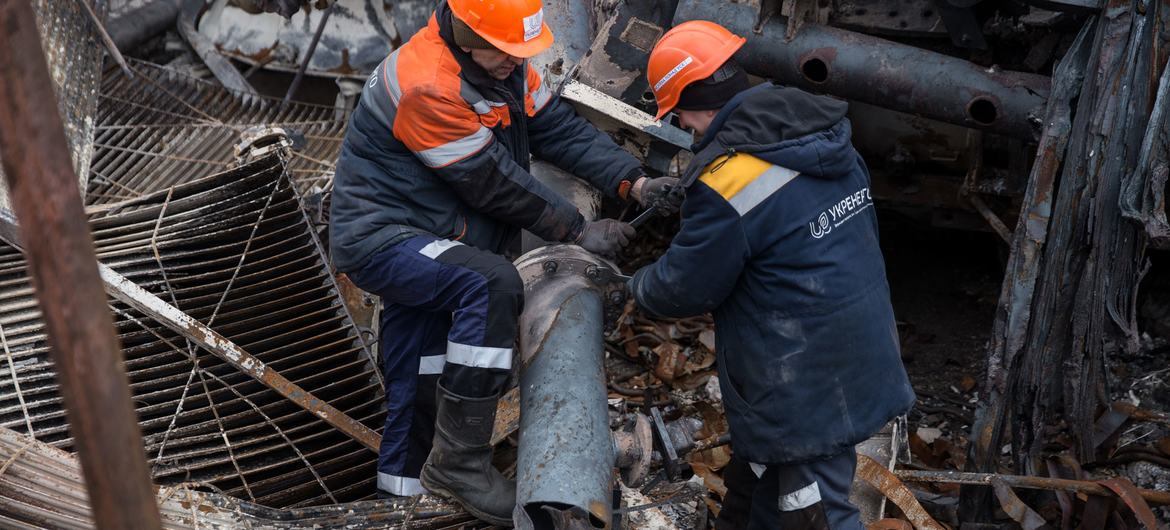 Workers repair damaged power infrastructure in Ukraine. (file)