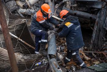 Workers repair damaged power infrastructure in Ukraine. (file)