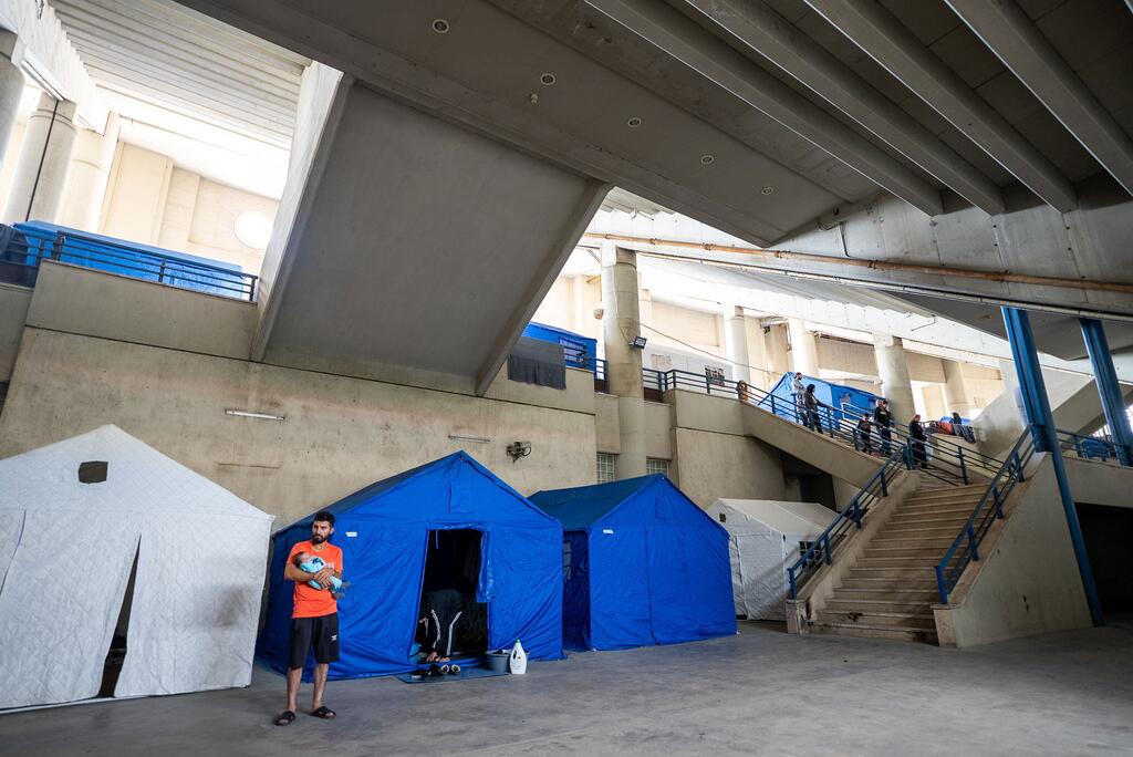 People who fled their homes due to the conflict are now living in tents in a sports stadium in Beirut, Lebanon.