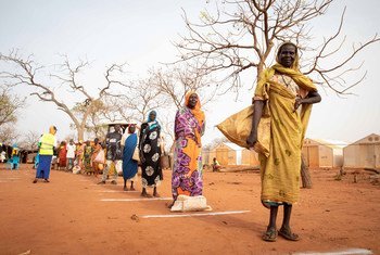 Refugees practice physical distancing st a camp in South Sudan