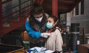 Seven-year-old Francesca [NAME CHANGED], receives a medical screening from Doctor Antonella Tochiaro in an informal settlement where she lives in Rome, Italy. Doctor Tochiaro is part of the INTERSOS/UNICEF outreach team.