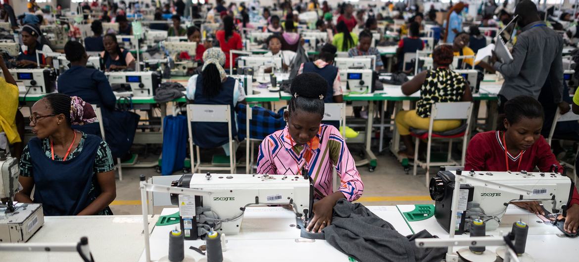 In a factory, workers make readymade clothing in Ghana. In a factory, workers make readymade clothing in Ghana.