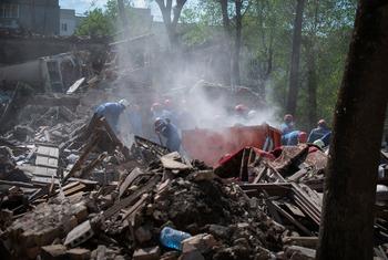 A bombed building smolders following an attack in the Ukrainian capital, Kyiv. (file)