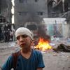 A boy, his head in bandages, stands in Rafah in the south of the Gaza Strip.