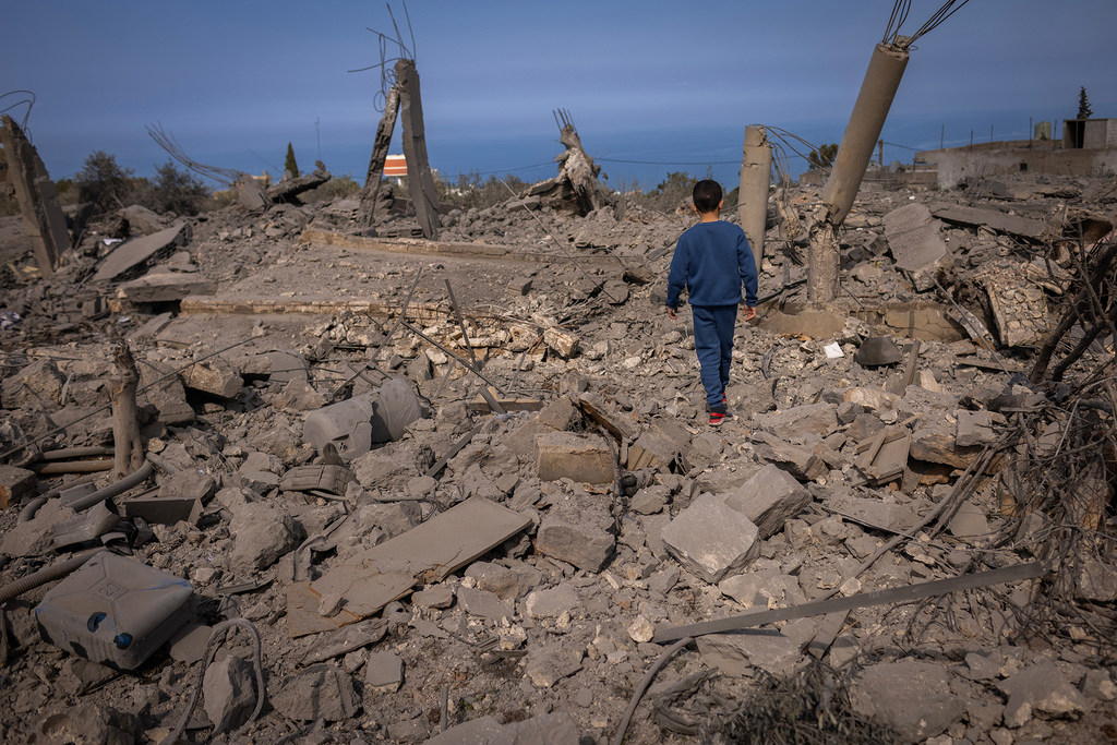 A boy walks across the rubble of buildings destroyed in a conflict in southern Lebanon. (file)