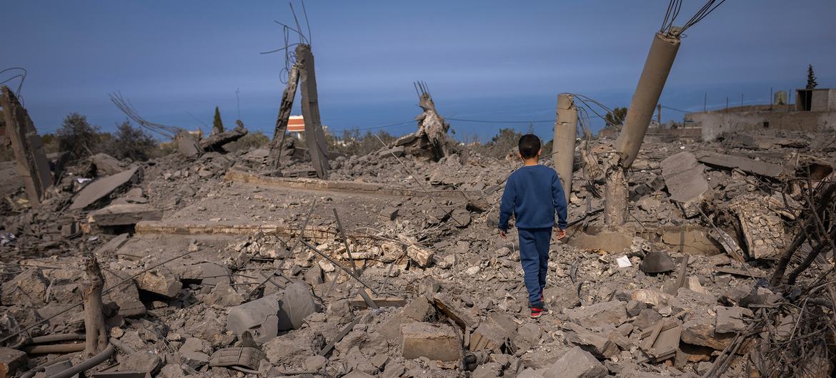 A boy walks across the rubble of buildings destroyed in a conflict in southern Lebanon. (file)