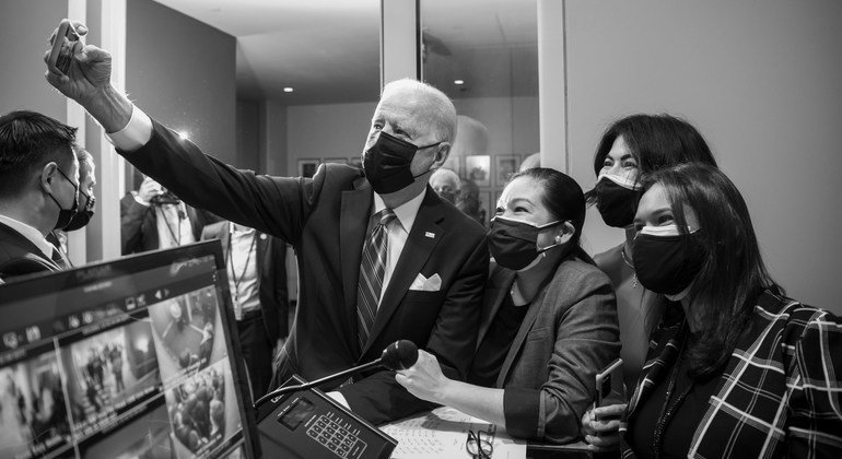 Joe Biden, President of the United States of America, takes a selfie photo with UN staff.