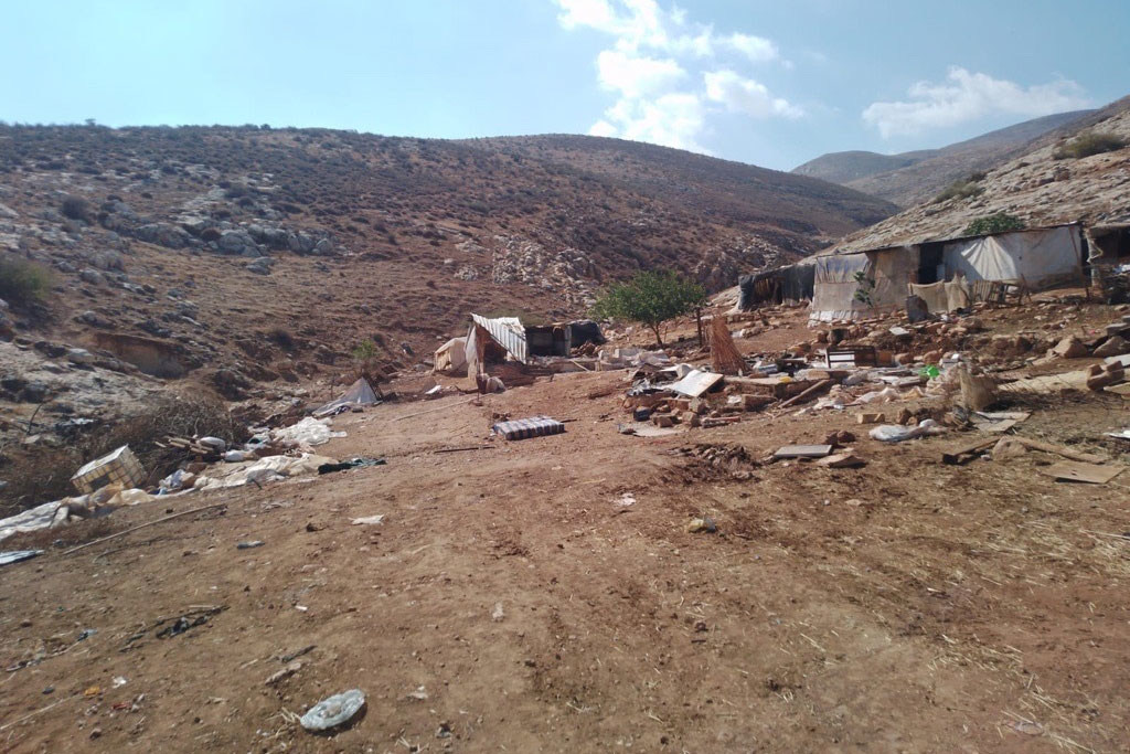 Las casas de familias palestinas yacen en ruinas en el este de Naplusa, Cisjordania.