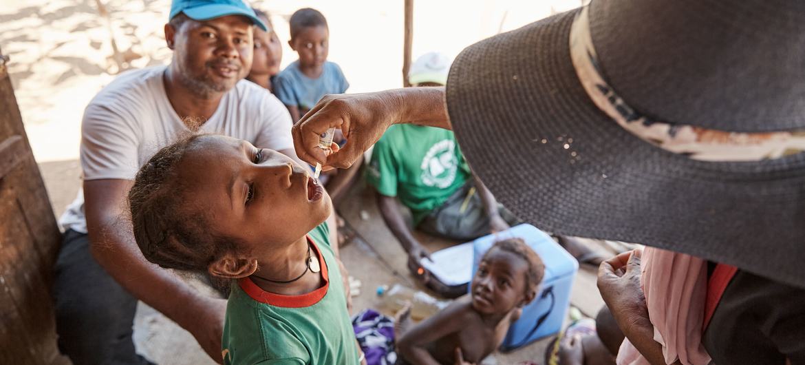 A child receives a dose of polio vaccine in Madagascar.