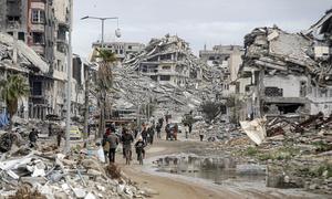 People return to devastated neighbourhoods in northern Gaza. About 90 per cent of the enclave's housing units are in ruins.