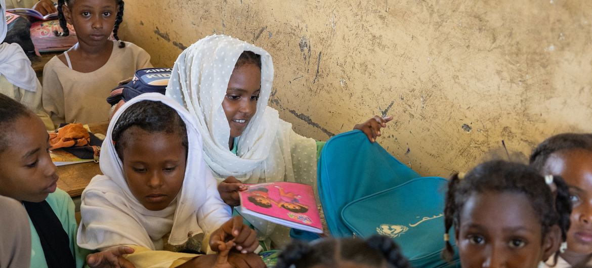 Wisam takes part in a lesson at her new school in Port Sudan.