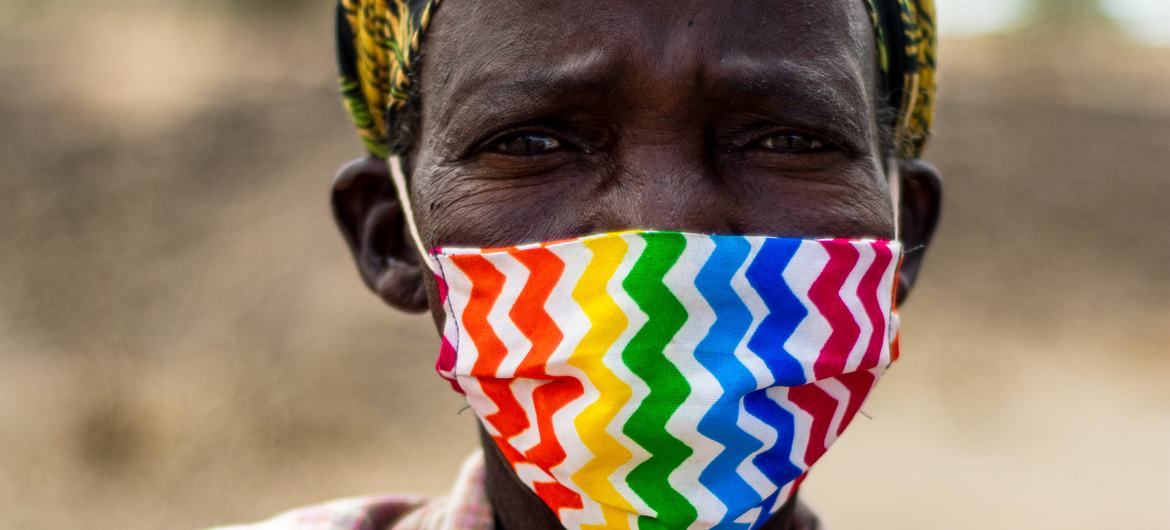 A woman wearing a mask, Malawi.