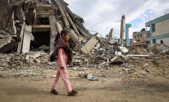 A young girl walks through destroyed streets in Khan Younis, in the southern Gaza Strip.