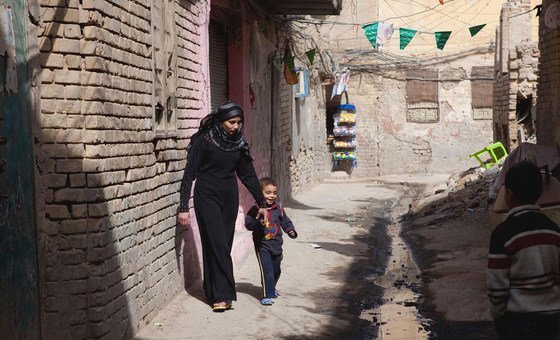 A woman and her son walk in the Futhal neighbourhood of Baghdad in Iraq. (file)