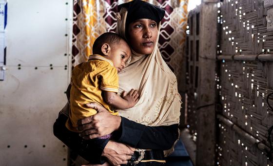 A woman holds her one-year-old son during a visit to a UNICEF nutrition facility in a Rohingya refugee camp in Cox’s Bazar, Bangladesh.
