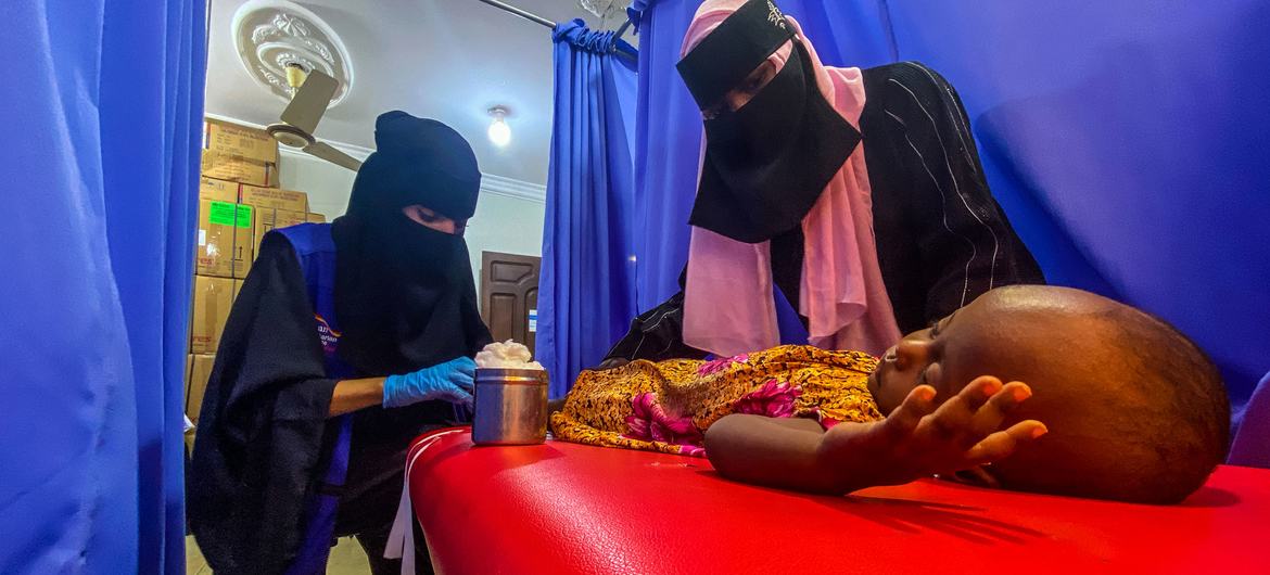 A young child is provided with healthcare in Aden, Yemen. 