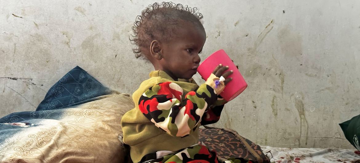 Three-year-old Shimba, who suffers from severe acute malnutrition, drinks therapeutic milk at the UNICEF-supported Port Sudan Pediatric Hospital.