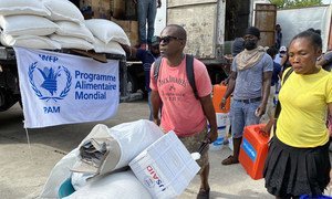 Haitians impacted by the recent earthquake in Les Cayes receive relief supplies for humanitarian agencies.  